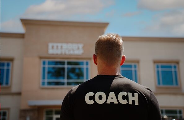 Bryce Henson in front of Fit Body Boot Camp location