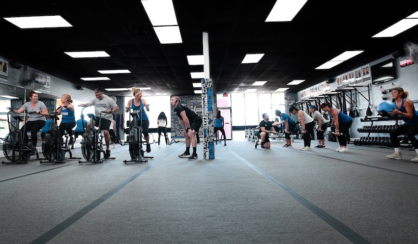 Various groups exercising at fitness bootcamp.
