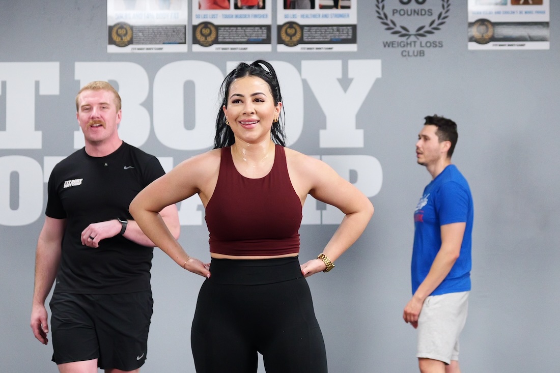 A woman posing in a group fitness gym