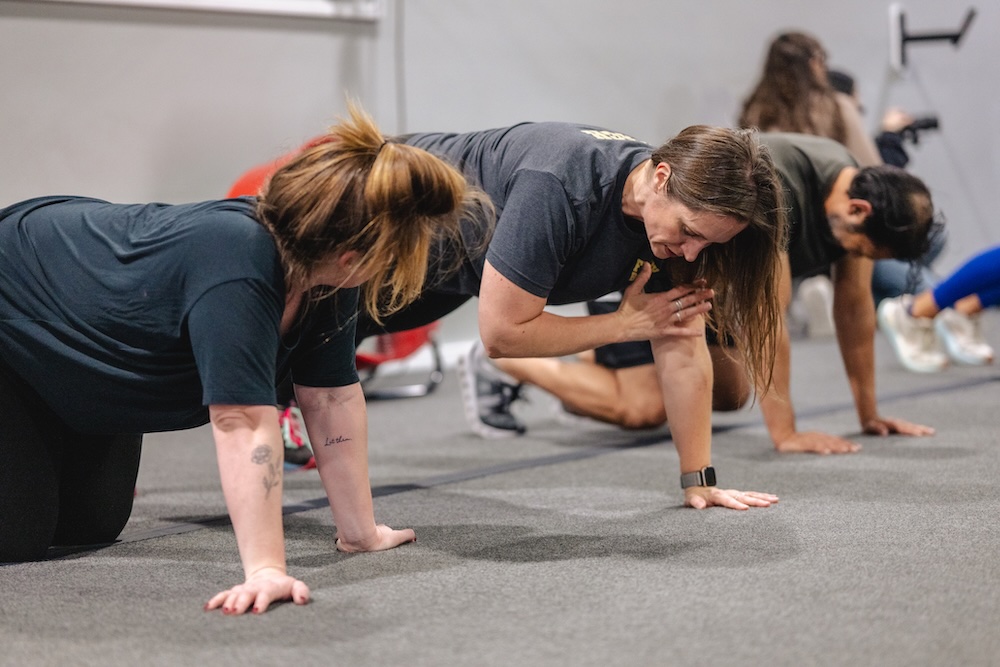 A group of people working out with modified workouts at group fitness